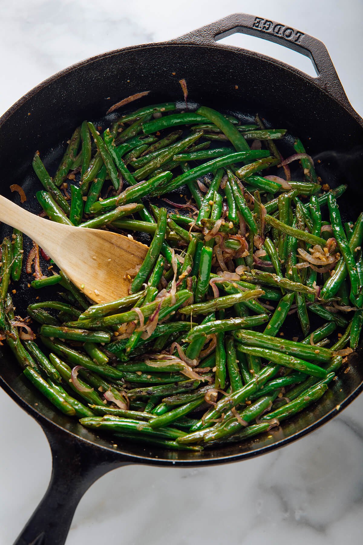 green beans cooked with red onion