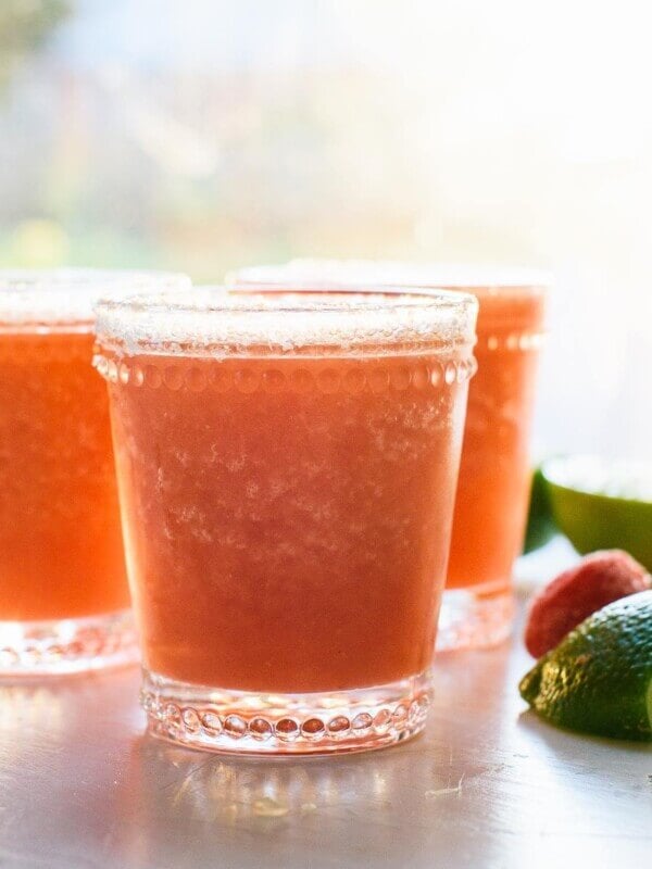Super refreshing frozen strawberry margaritas, made with all-natural ingredients! Ready in 10 minutes. cookieandkate.com