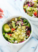 This delicious Mexican green salad with jalapeño-cilantro dressing is super fresh and mega nutritious! Vegetarian (easily vegan) and gluten free. cookieandkate.com