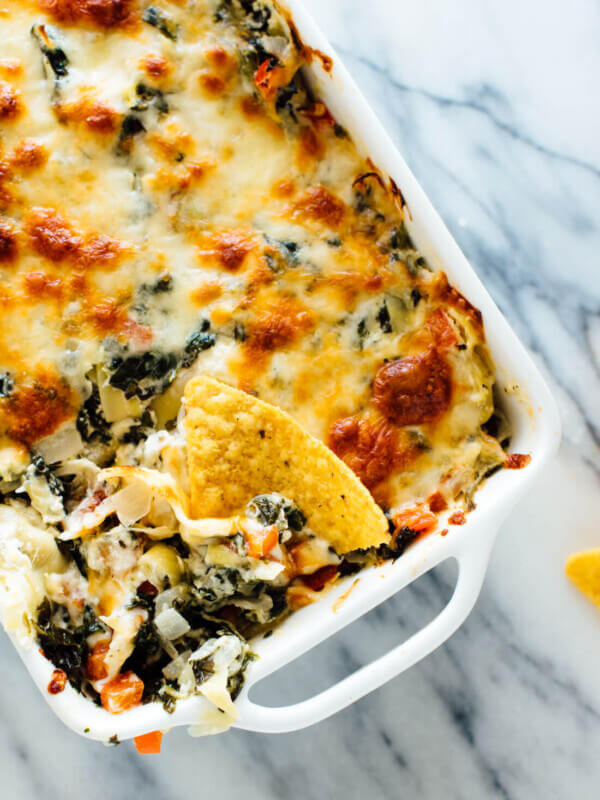 The best cheesy spinach artichoke dip, made lighter with extra veggies and no mayonnaise! Everyone will love this appetizer recipe.