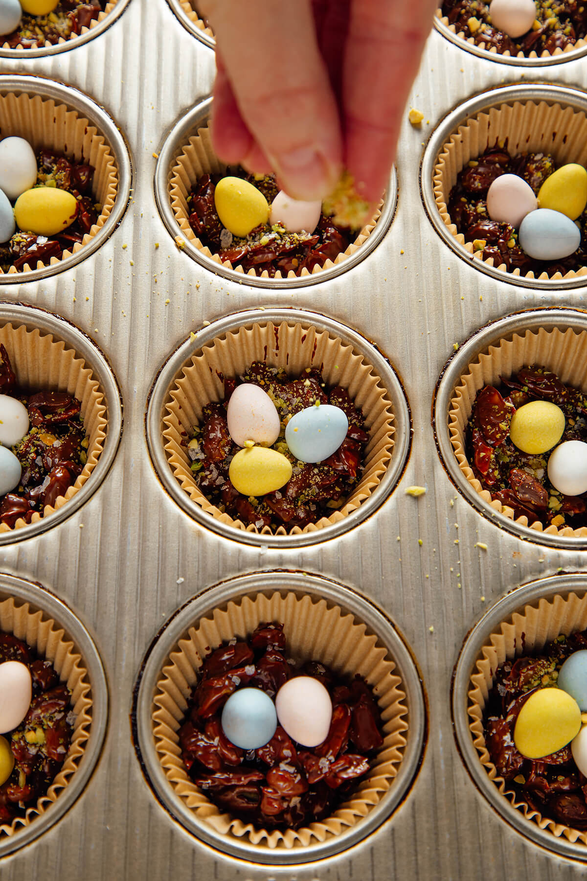 sprinkling pistachio on nests