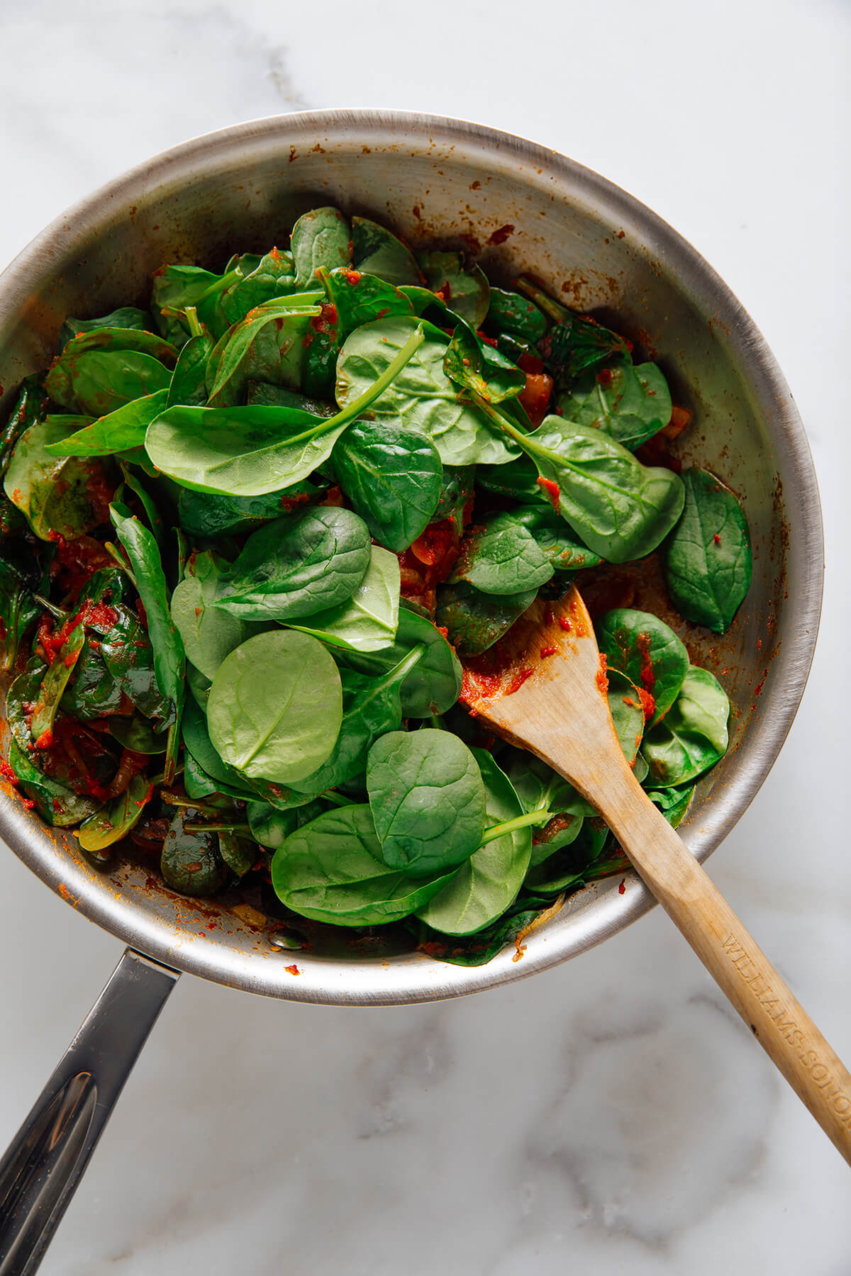 adding spinach